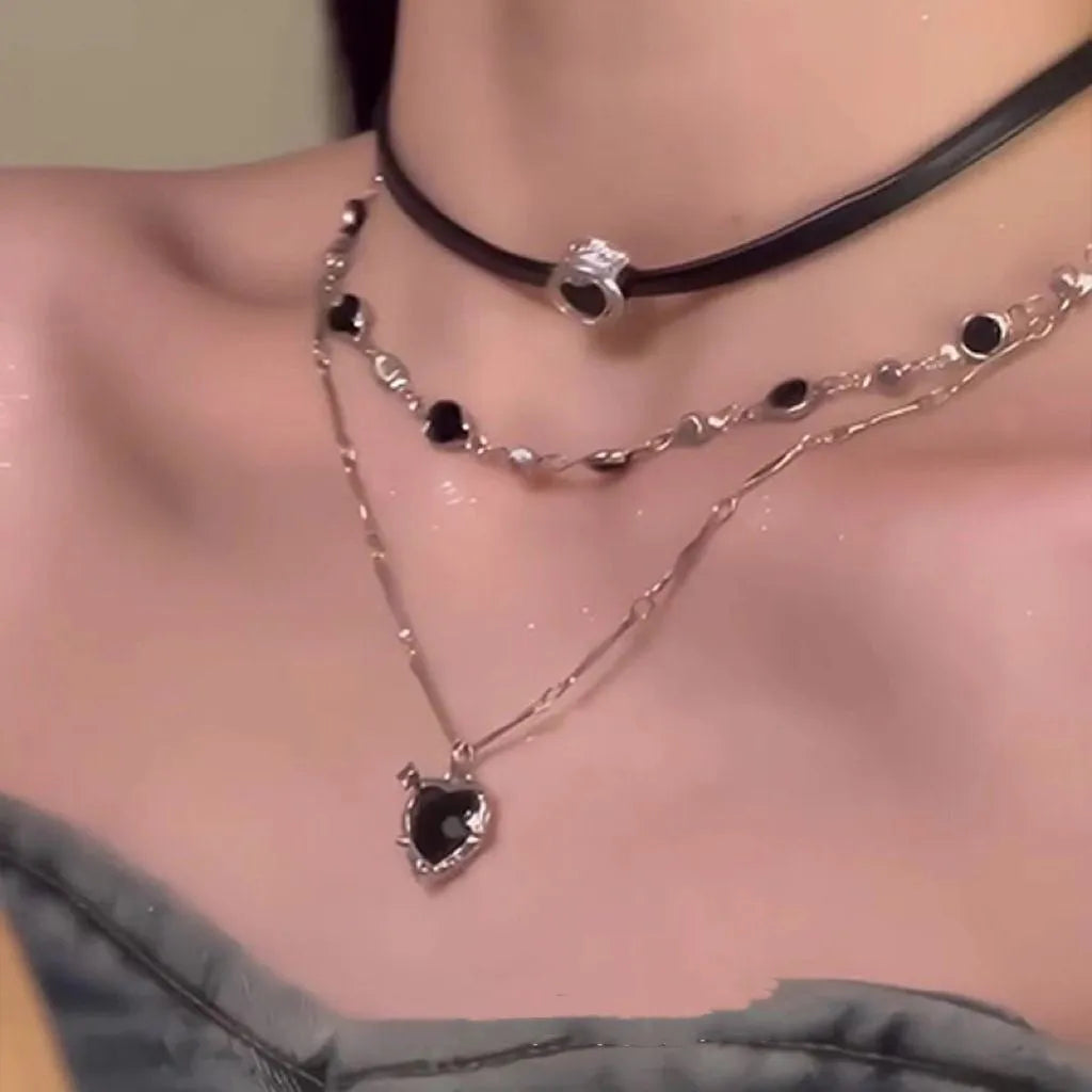 Women's twin-layer necklace with a leather-wrapped heart-shaped alloy pendant on an adjustable chain.