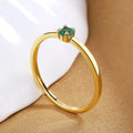 Geometric copper women's ring with a single diamond, shown in blue, green, red, and white colour variations.