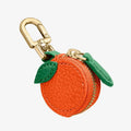 PU leather mini coin bag on a keychain in cherry, blueberry, or orange colour