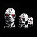 Retro ghost head skull stud earrings with red eye detailing on electroplated alloy