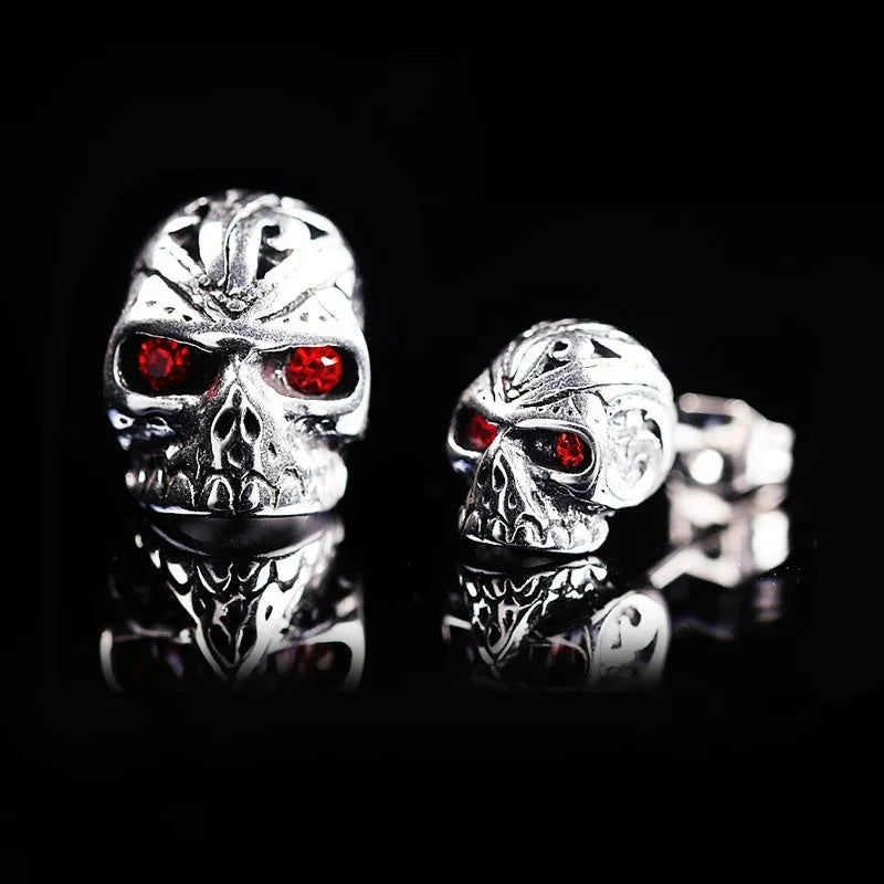 Retro ghost head skull stud earrings with red eye detailing on electroplated alloy