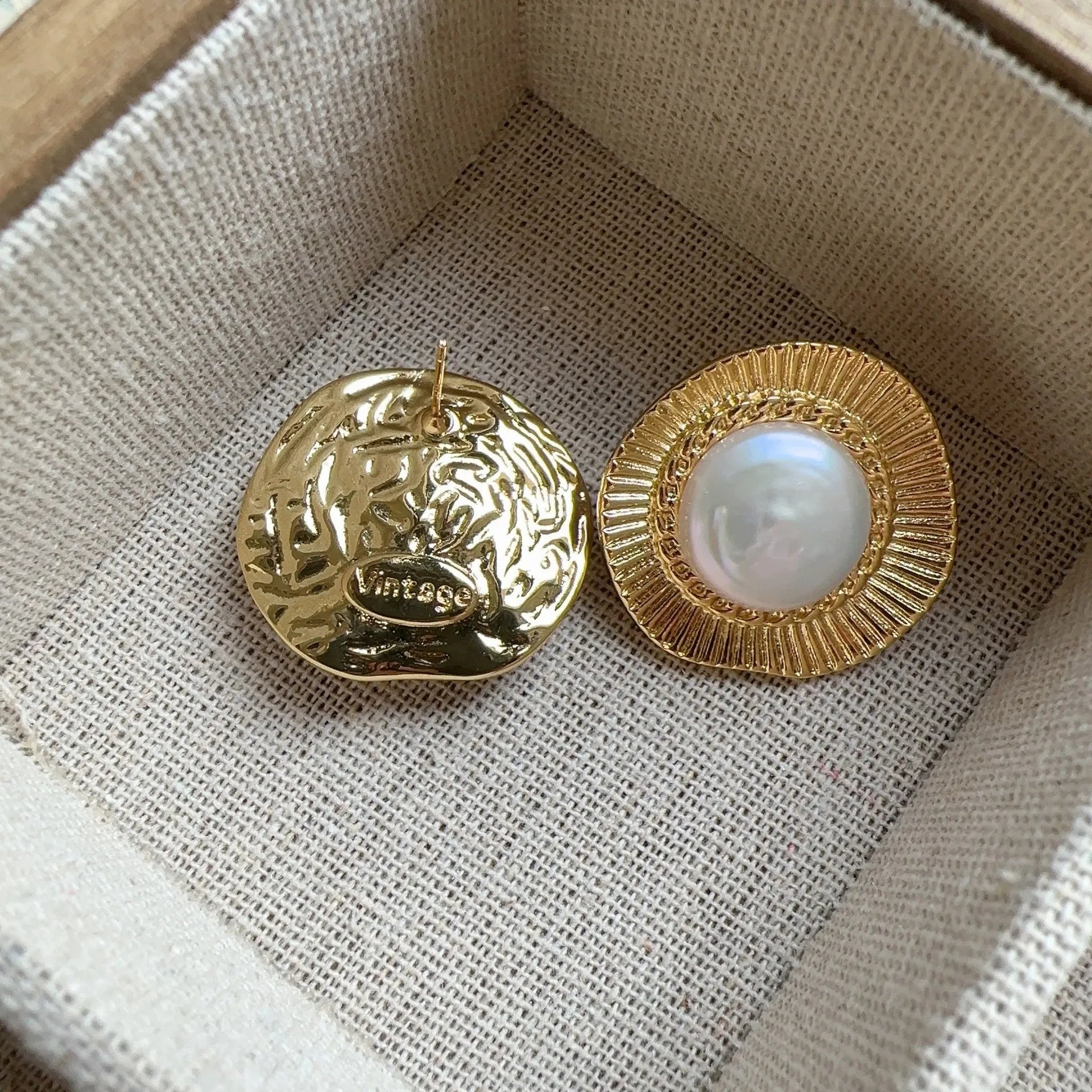 A pair of round gold electroplated earrings with a French retro simple style for women.