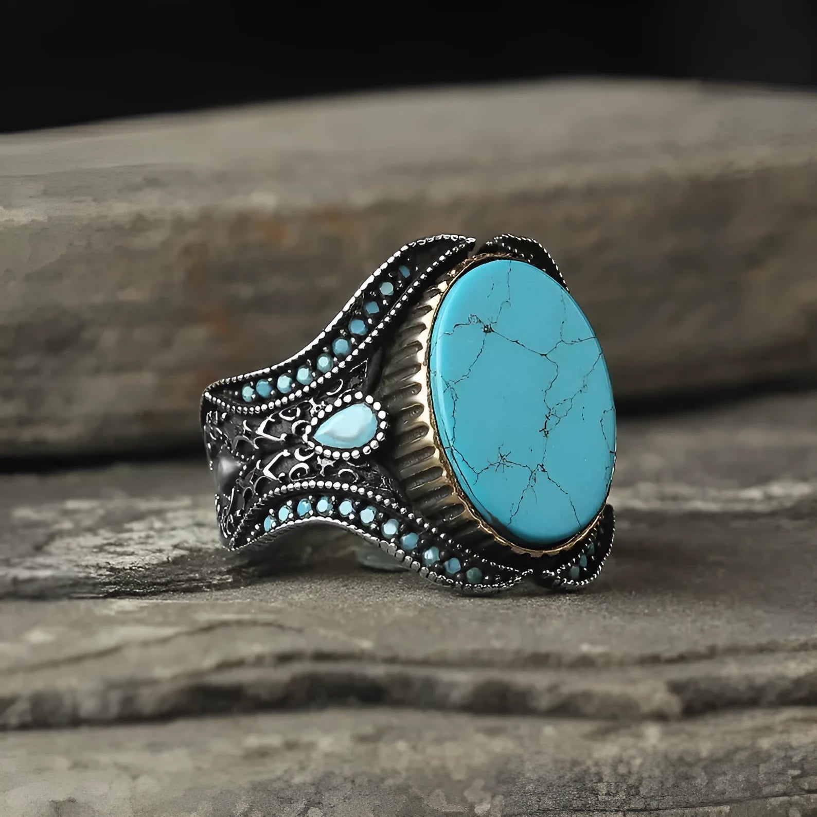 Men's round turquoise alloy ring with antique silver finish shown on finger
