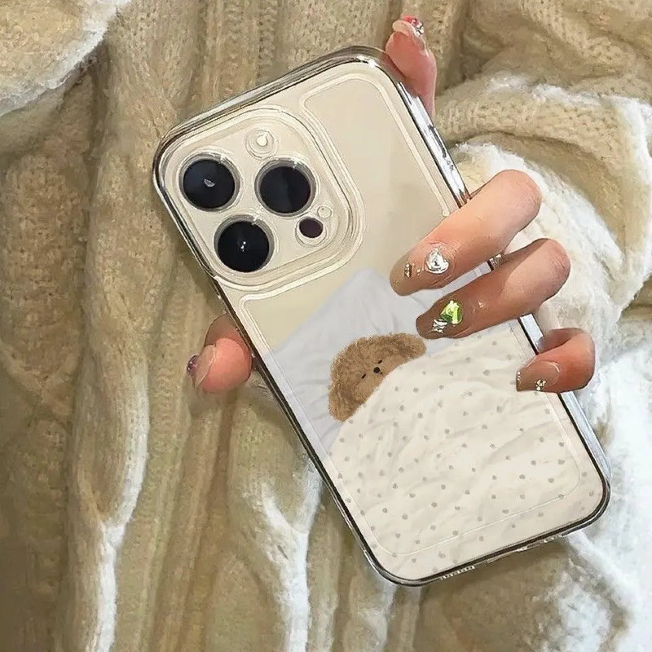 Transparent Apple iPhone case showing a sleeping cat pattern design on a clear TPU background.
