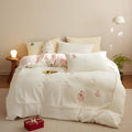 Winter milk fibre four-piece bedding set with green or pink Christmas tree pattern on a fresh style quilt cover.