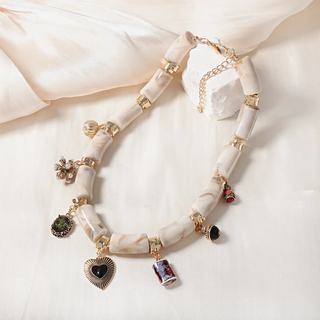 Heart-shaped resin bamboo necklace with electroplated finish in pictured colour