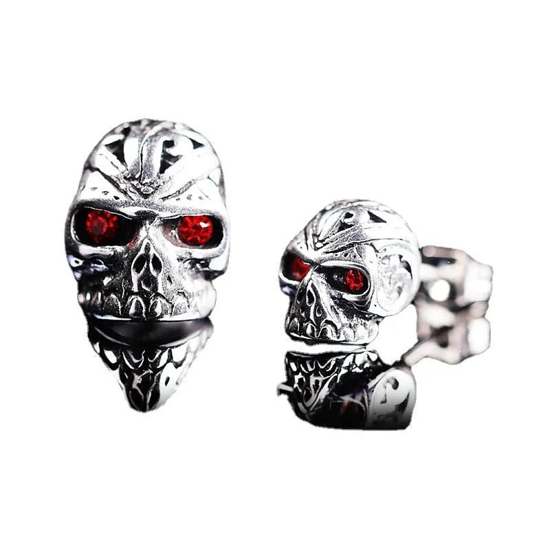 Retro ghost head skull stud earrings with red eye detailing on electroplated alloy
