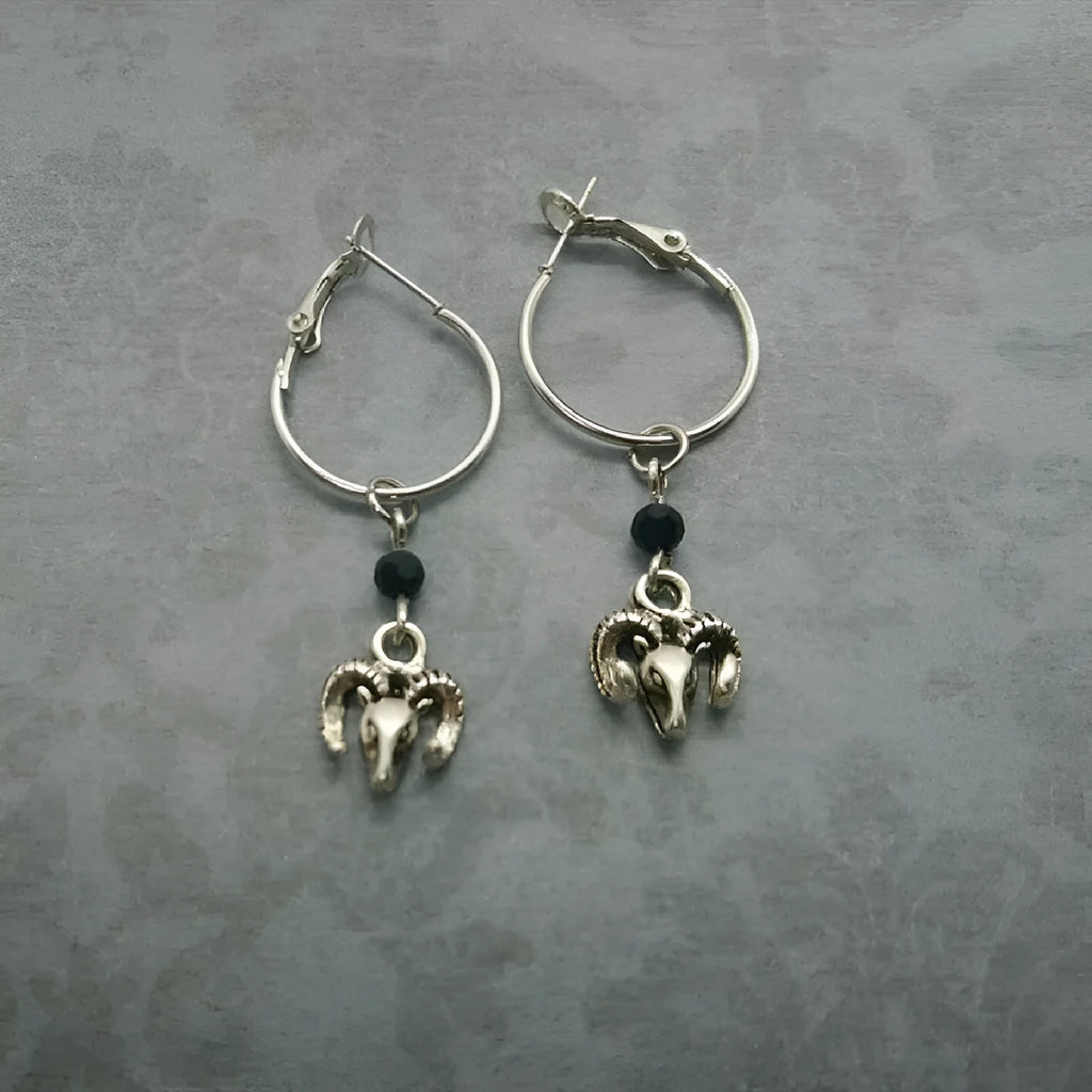Silver round ring alloy earrings with Tibetan antelope design from Yunnan.