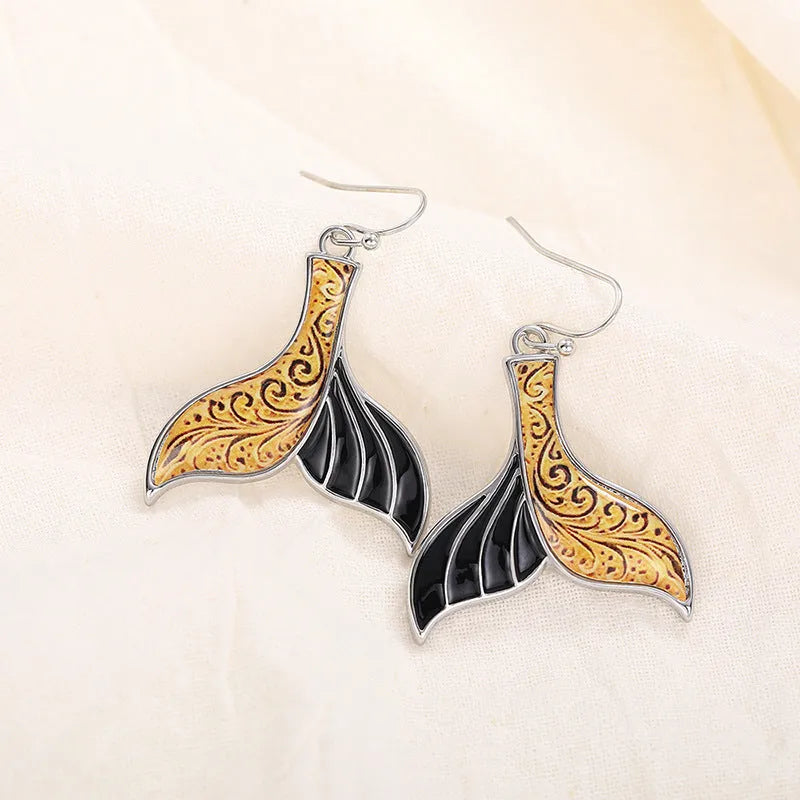 Women's white gold-colour fishtail earrings with whale design elements in retro style