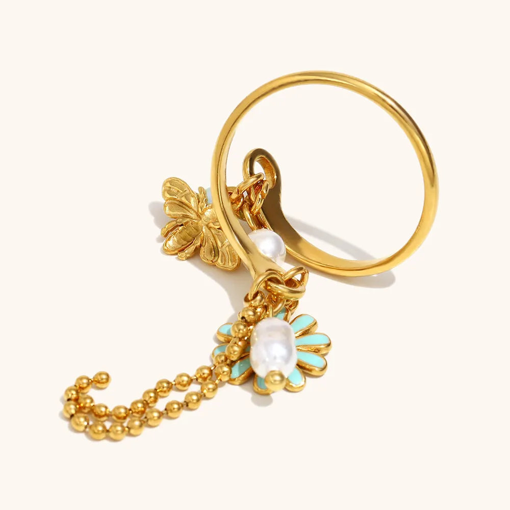 Tassel open ring in stainless steel with 18K gold plating featuring bee and daisy design