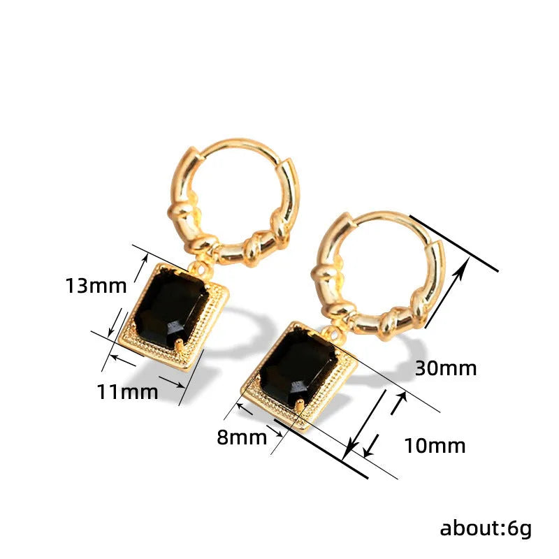 A pair of square geometric copper earrings with a black zircon in a French court retro setting.