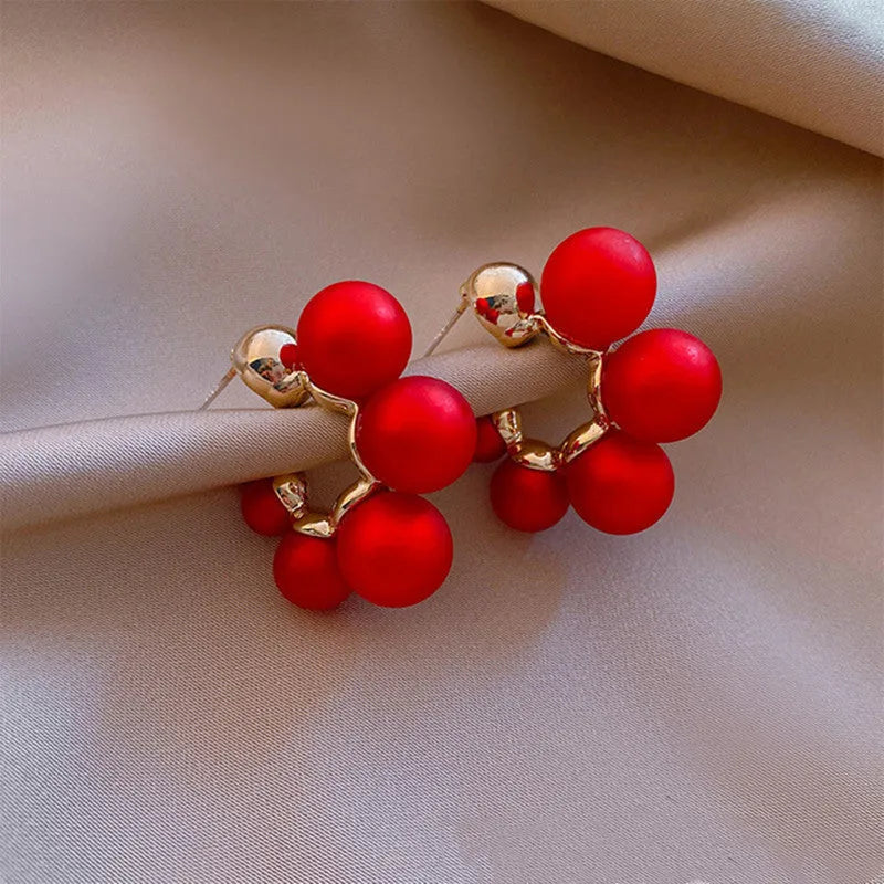 Women's red bell-shaped alloy earrings with drop pendant design