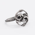 Steel coloured titanium steel ring featuring a detailed retro double snake design on a finger.