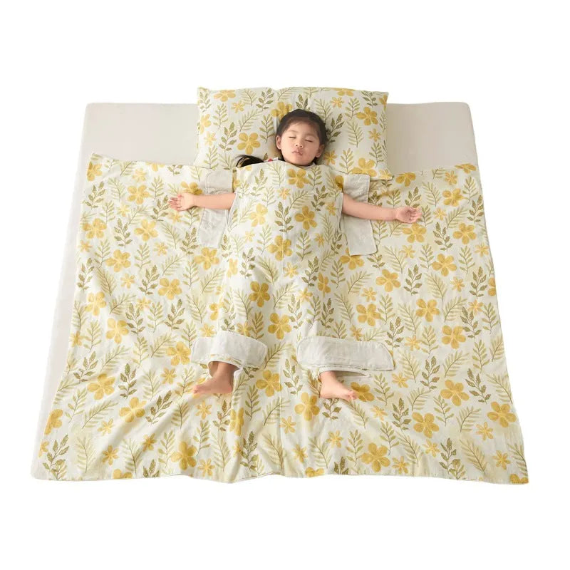 Patterned anti-kick sleeping bag blanket laid flat on a bed, showing its quilted texture.