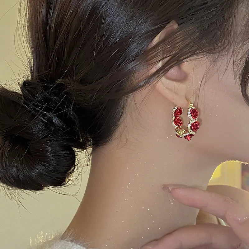 Alloy rose flower ear clip earrings in F155A red colour with clip-on fastening