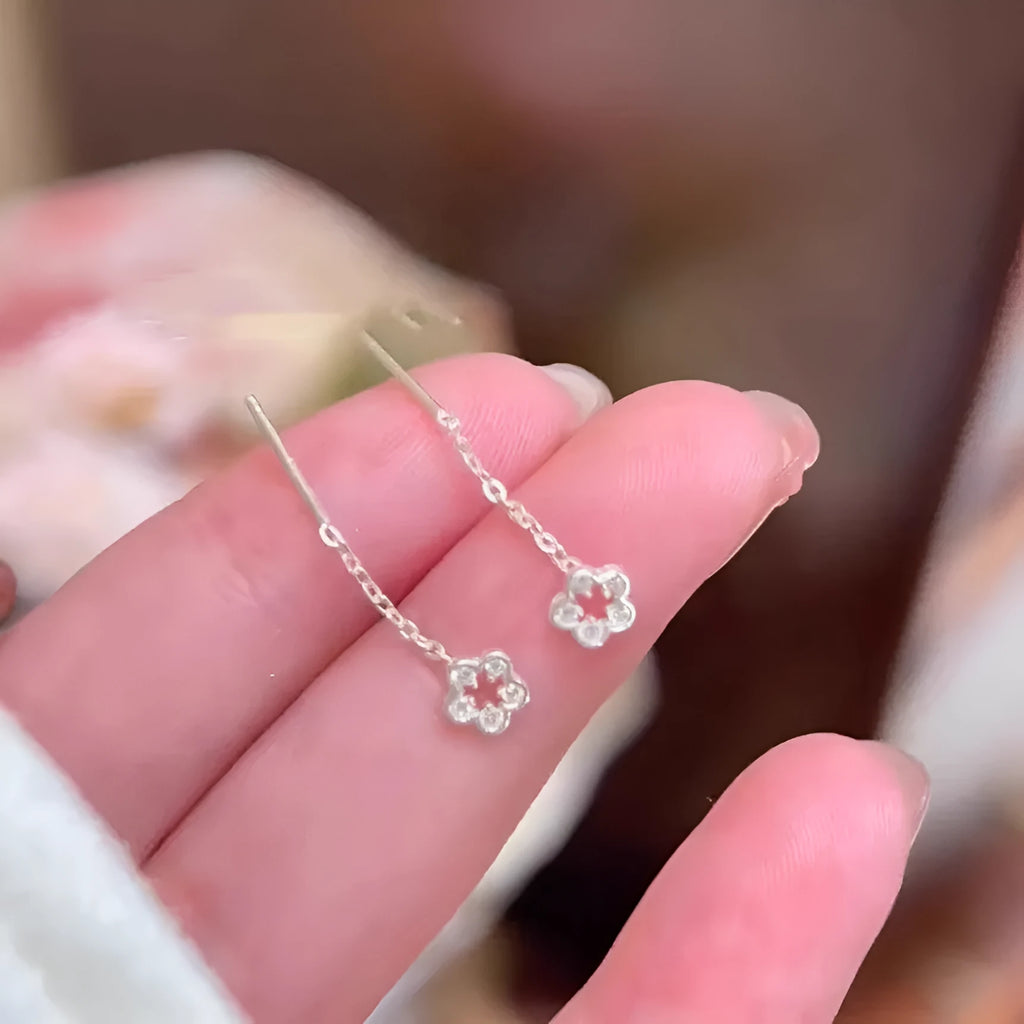Pair of alloy silver hollow flower hanging earrings
