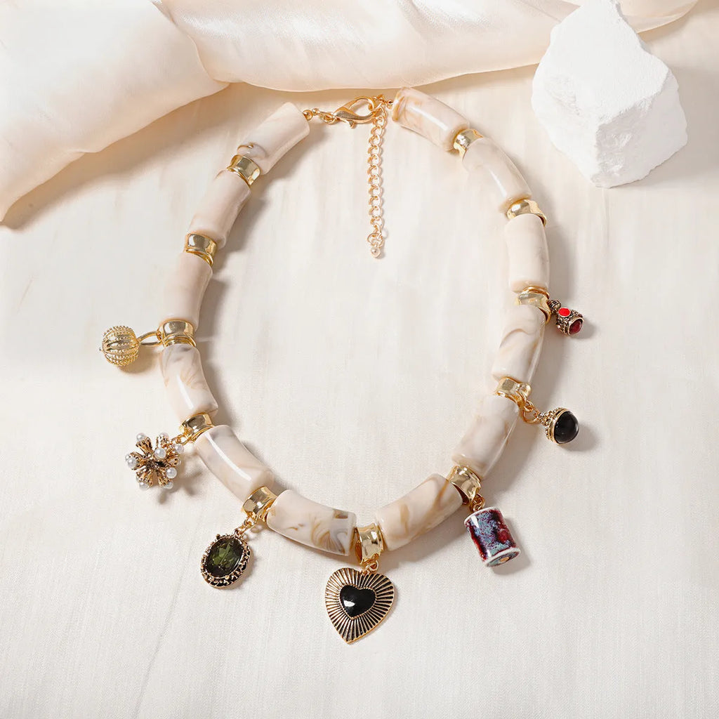 Heart-shaped resin bamboo necklace with electroplated finish in pictured colour