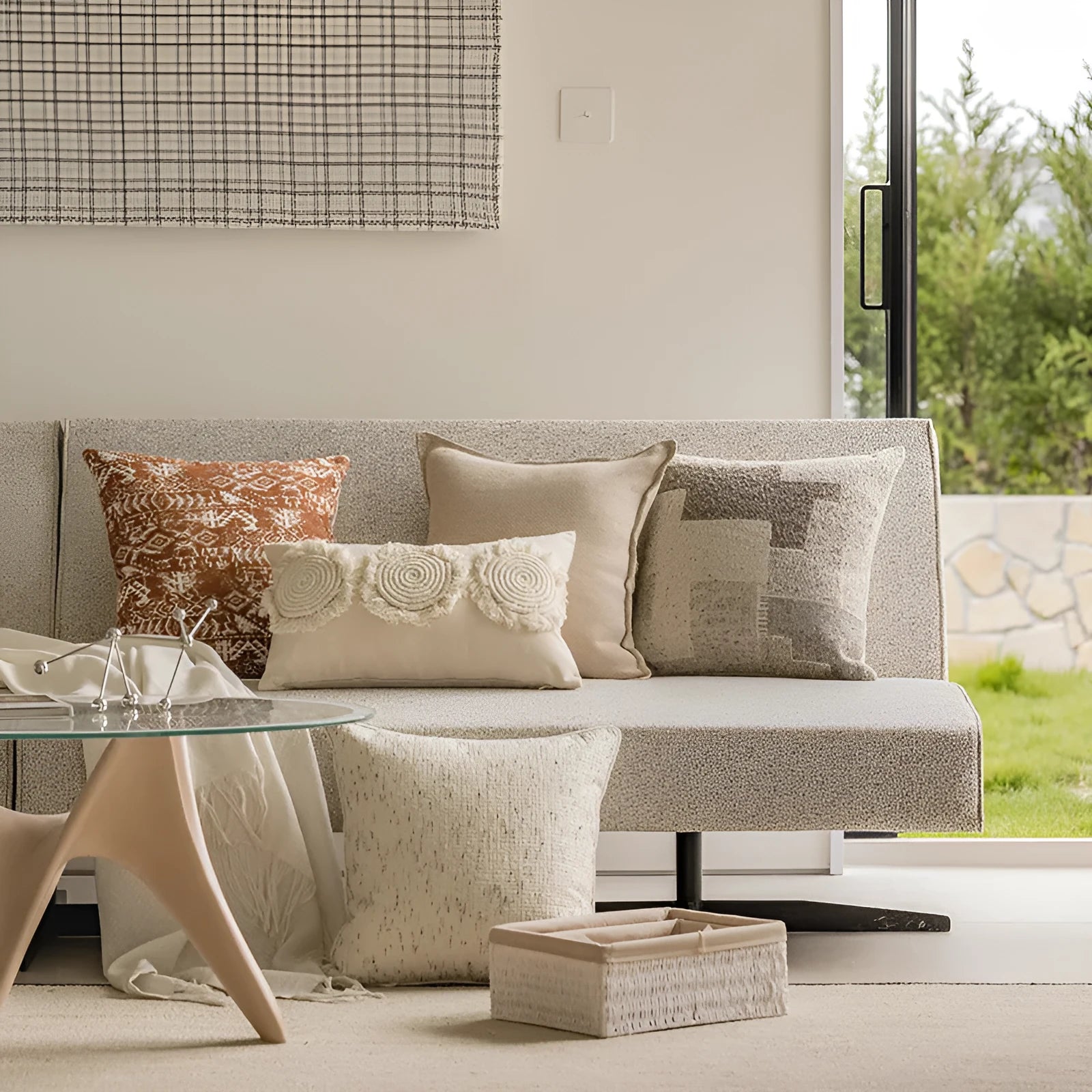 A 45cm square solid-colour cushion with stitched edges on a grey sofa.