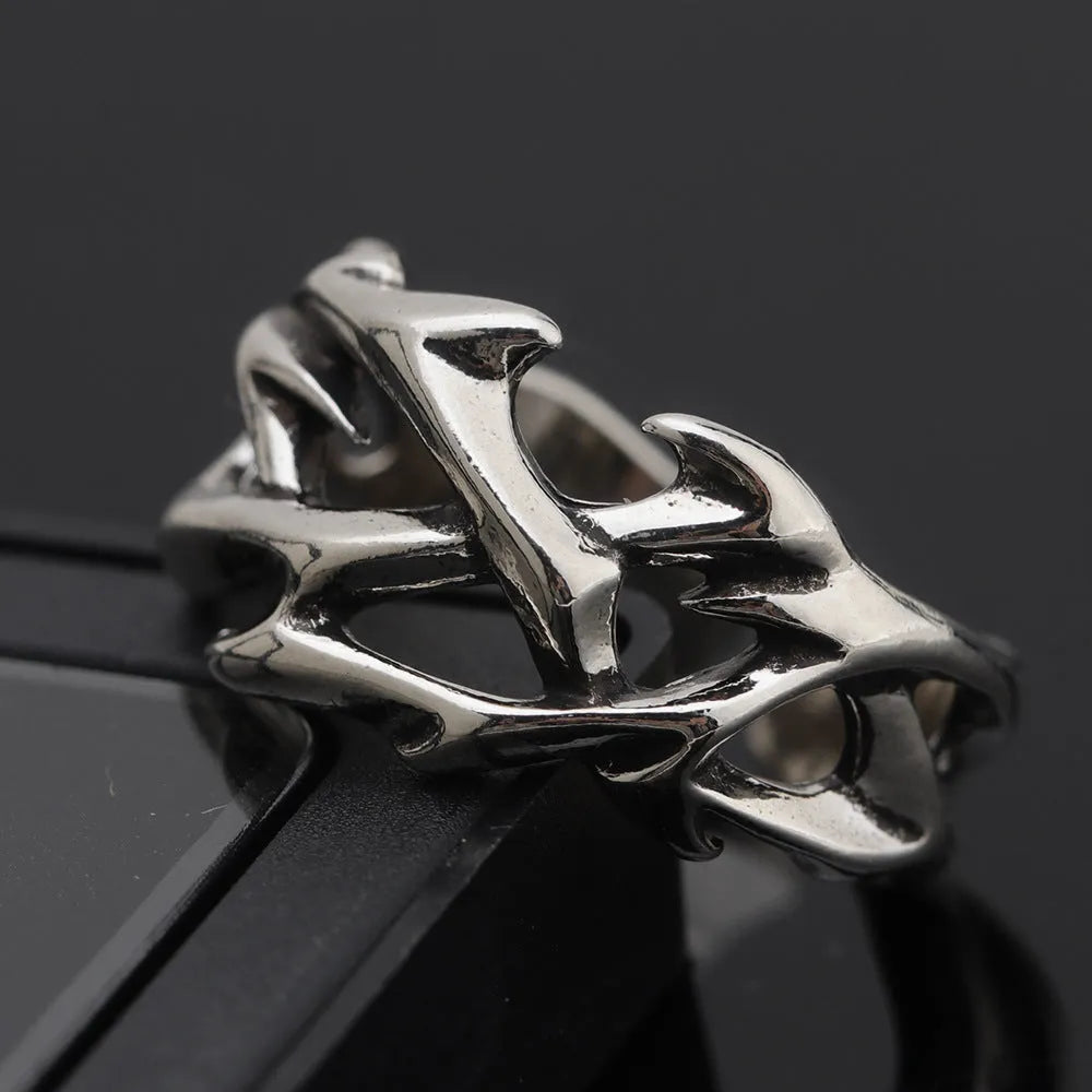 Copper men's ring with geometric thorn flower design and adjustable opening.