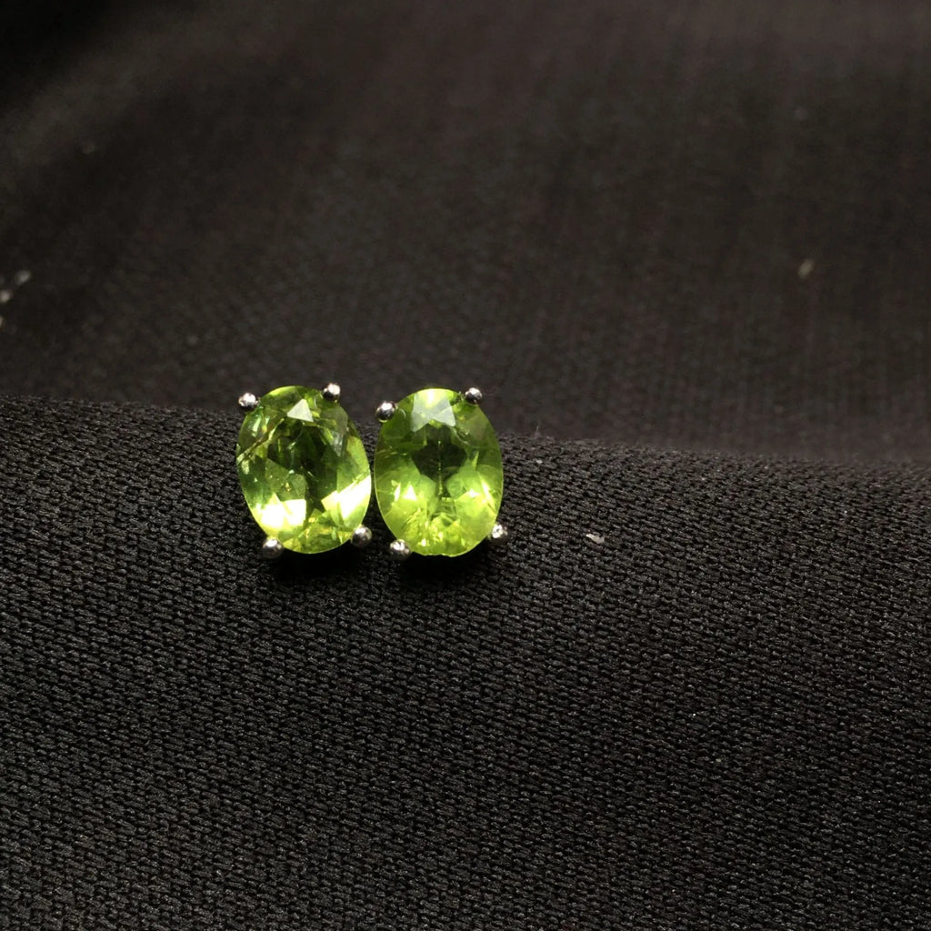 Natural grass green olivine faceted stud earrings in S925 silver setting, 6x8mm geometric ellipse shape