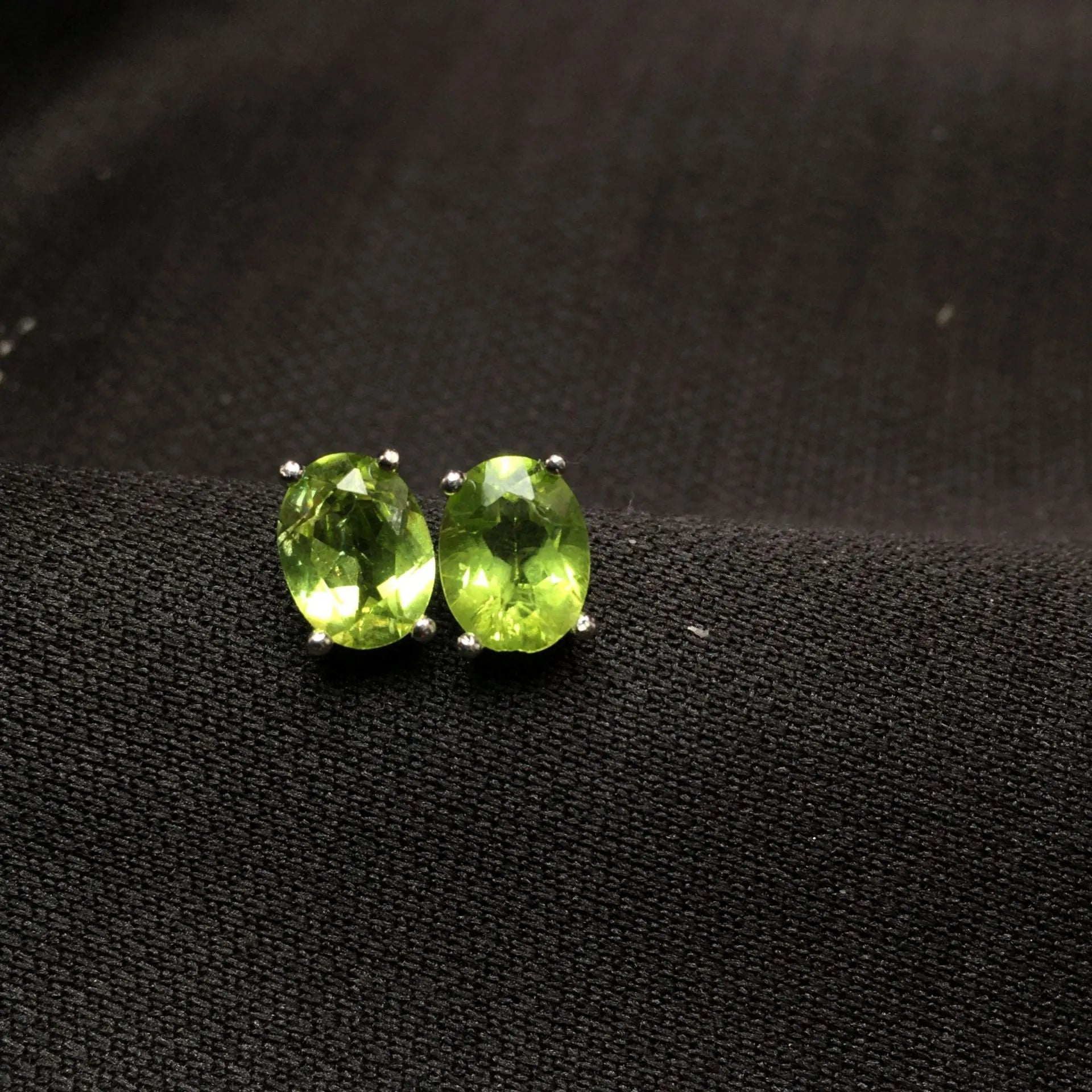 Natural grass green olivine faceted stud earrings in S925 silver setting, 6x8mm geometric ellipse shape
