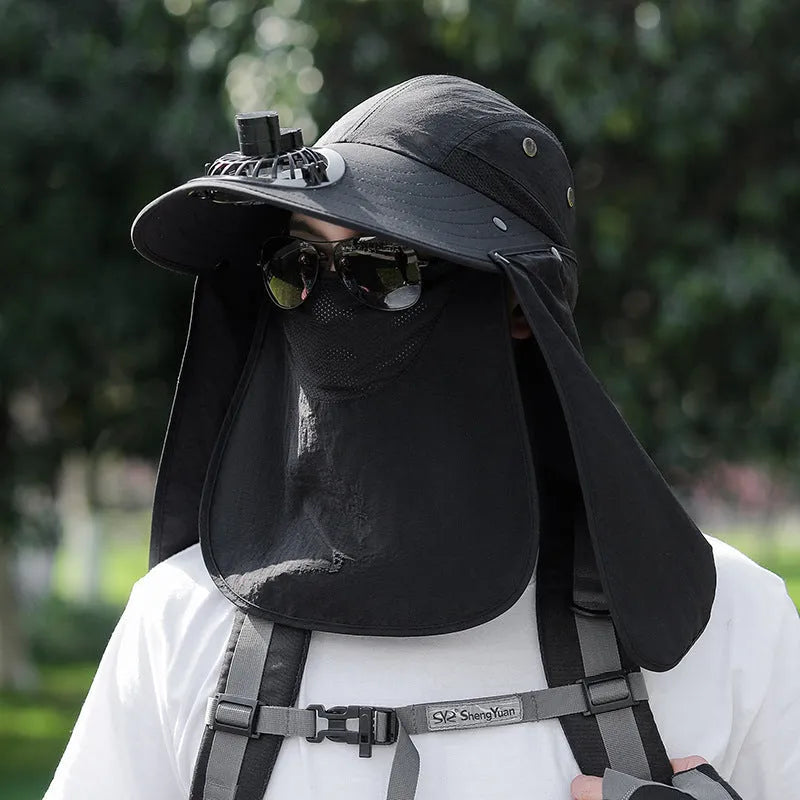 Man wearing a khaki sun hat with a built-in USB-rechargeable fan for face and neck protection.