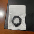 Silicone delayed ejaculation men's ring in black colour on a plain background