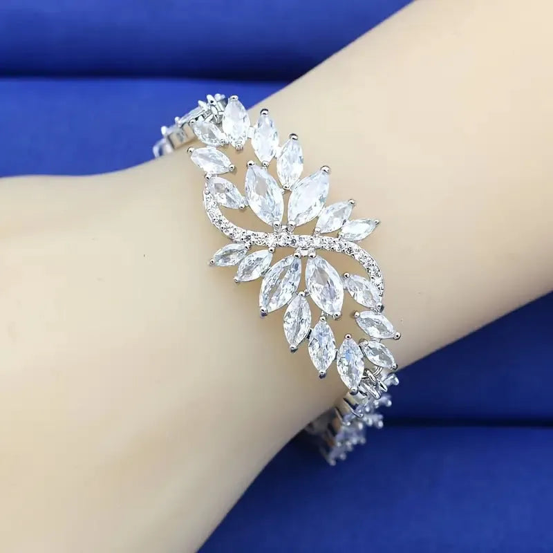 Copper fashion bracelet with gold electroplating and coloured zircon stones in ice flower design
