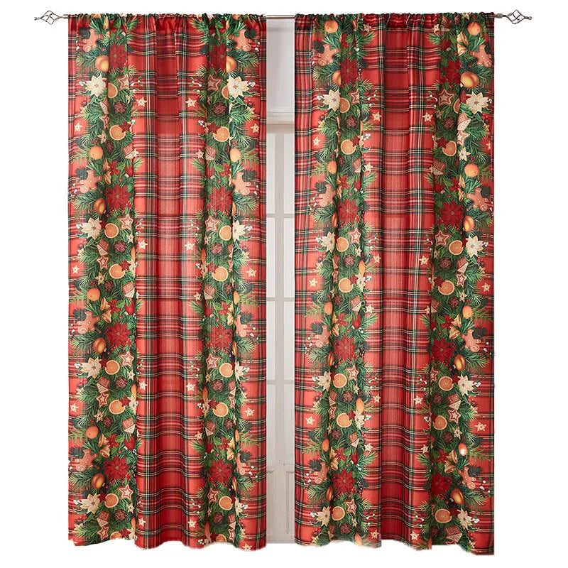 Rectangular printed polyester curtain with festive design hanging in a window