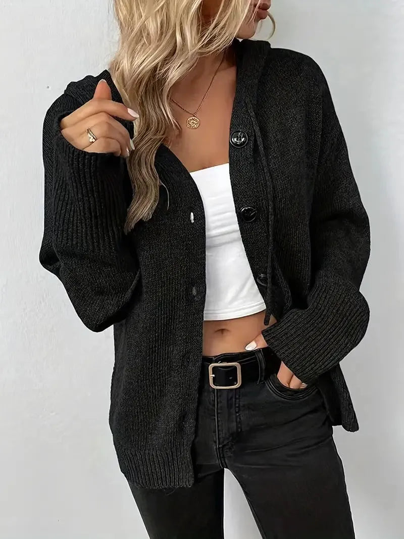 A solid colour hooded cotton cardigan sweater shown in a loose fit on a model.