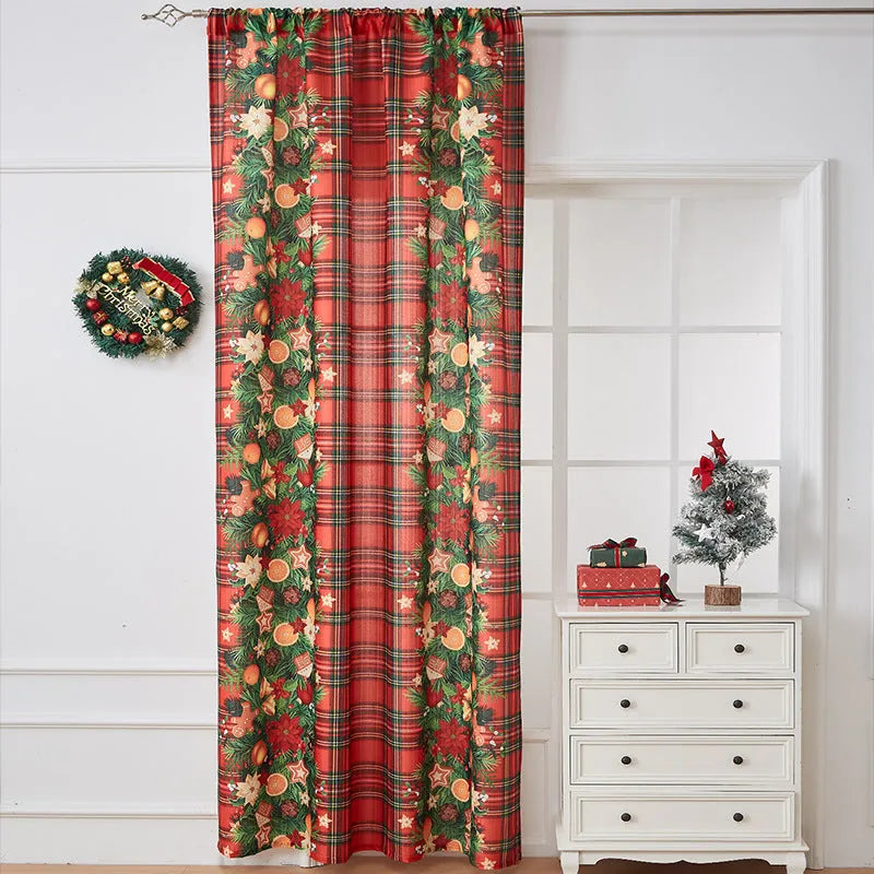 Rectangular printed polyester curtain with festive design hanging in a window