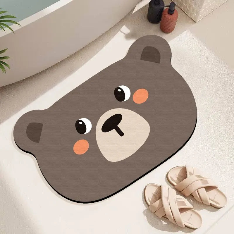 Thickened diatom oil bathroom mat with cartoon animal design in alien shape for shower area water absorption.