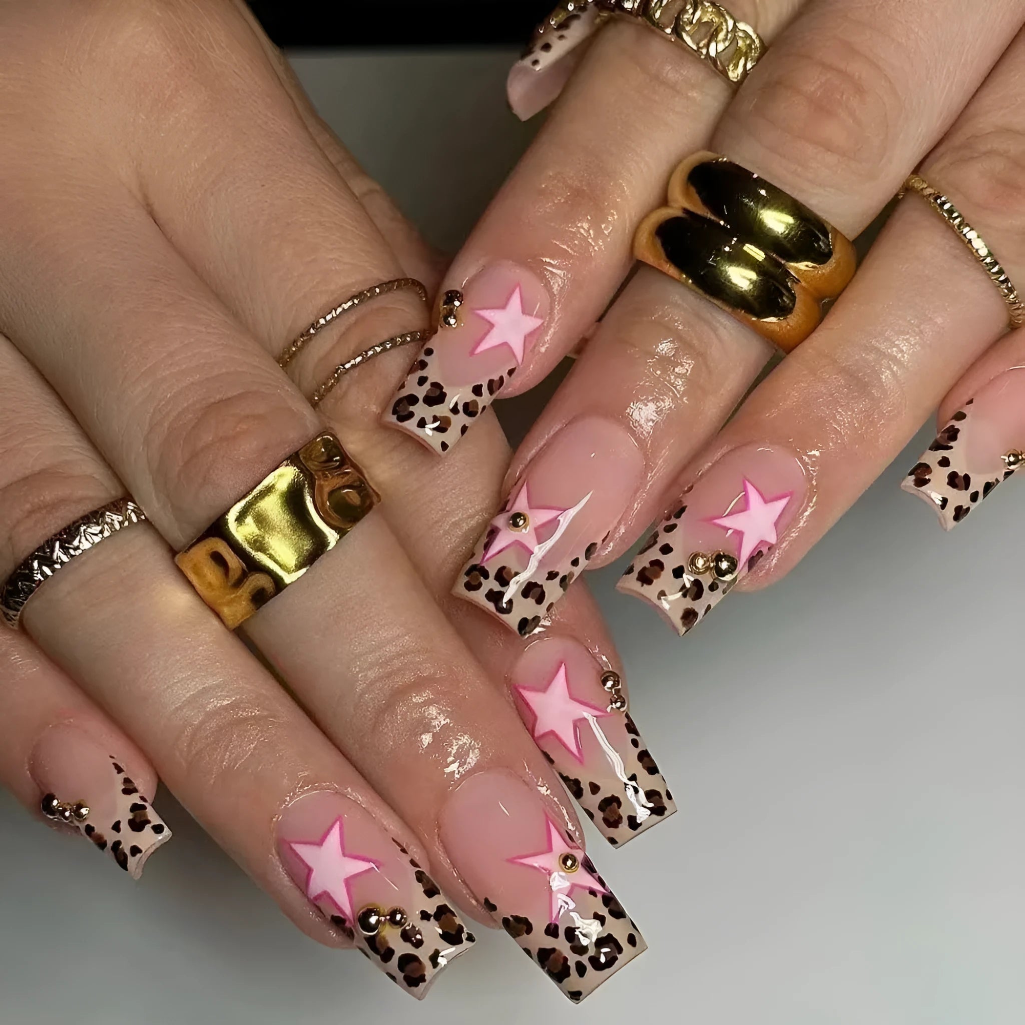 False nails with leopard print French design and star-shaped pearl diamond decoration
