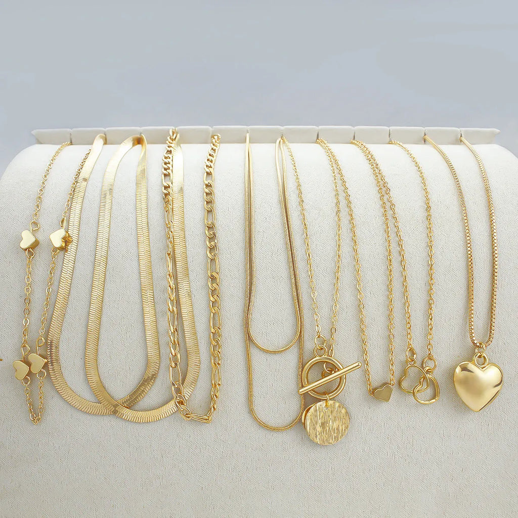 Gold women's necklace set with 10 alloy pendants on adjustable snake bone chain