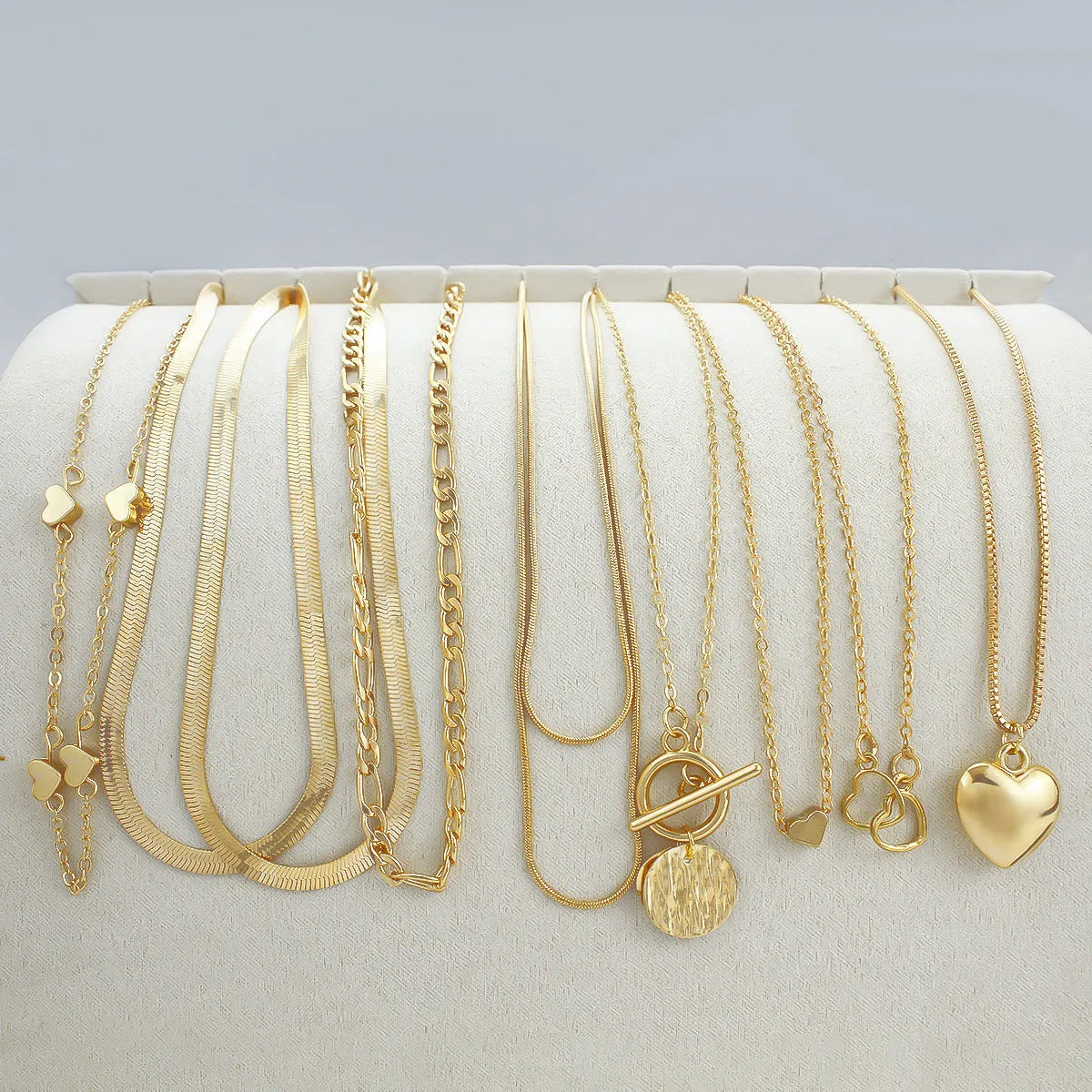 Gold women's necklace set with 10 alloy pendants on adjustable snake bone chain