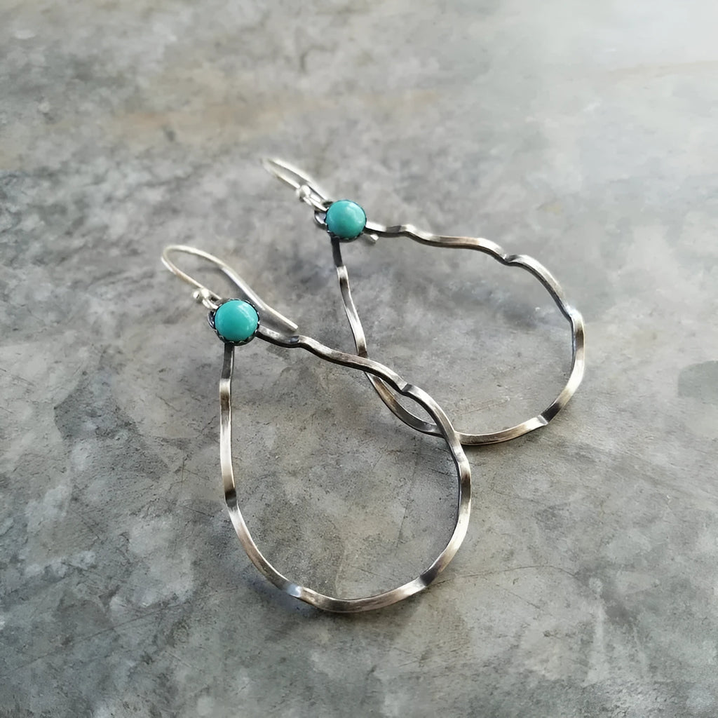 Bohemian-style vintage circle earrings with turquoise geometric detailing in antique silver finish