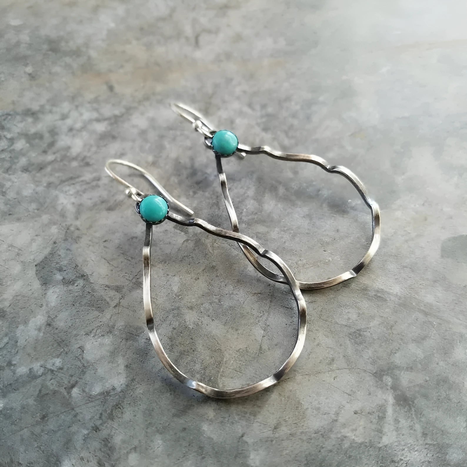Bohemian-style vintage circle earrings with turquoise geometric detailing in antique silver finish
