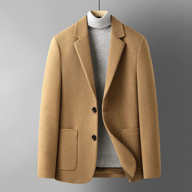 Men's slim fit wool suit jacket in grey shown on a hanger.