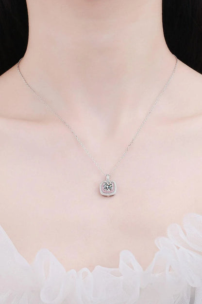 A sterling silver geometric pendant necklace featuring a radiant Moissanite centre stone and accented with shimmering zircon stones