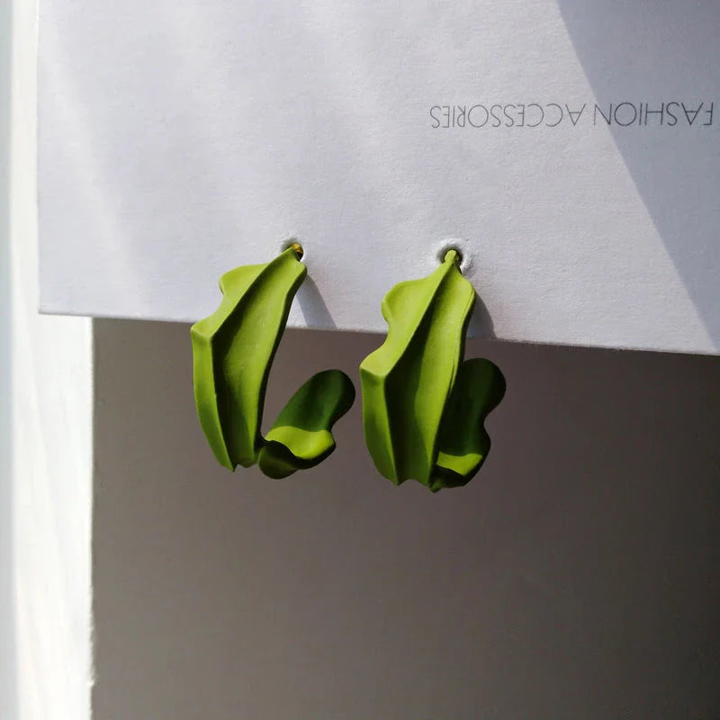 Stylish green leaf geometric drop earrings with a modern, trendy design