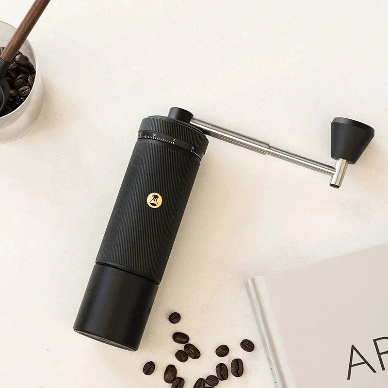 Premium manual coffee grinder with sleek design, stainless steel burrs, and external grind adjustment for customizable brewing