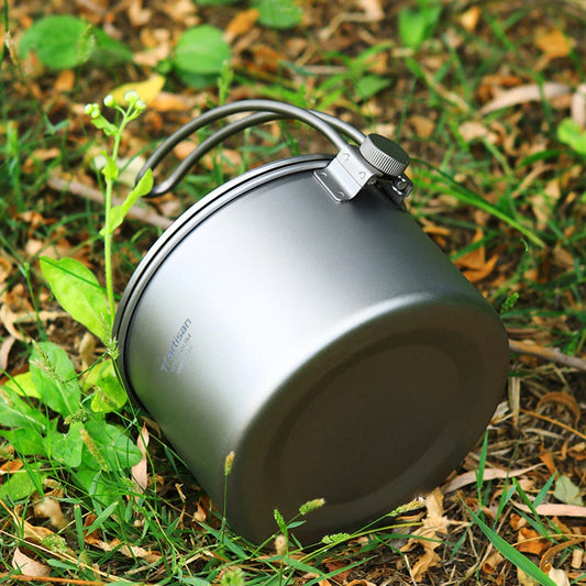 1.1L titanium camping pot with storage sack, perfect for brewing hot drinks, cooking meals, and boiling water on outdoor adventures