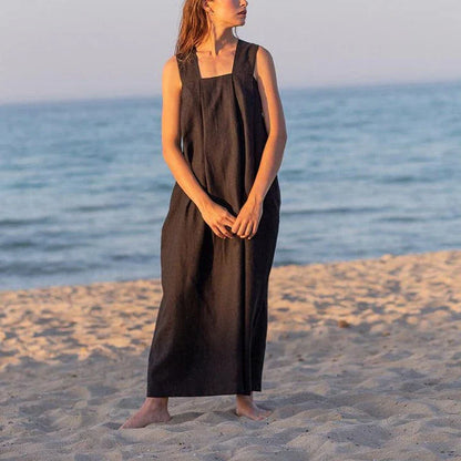 Stylish square collar sleeveless midi sundress in black, featuring a flowing A-line silhouette and practical pockets for versatile summer wear.