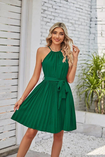 A stylish halter sundress with a pleated skirt, perfect for warm Kiwi summer days