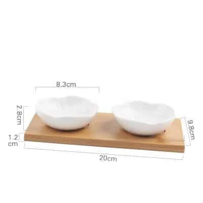 Stylish ceramic snack trays with natural wood pallet, perfect for serving nibbles and entertaining in Kiwi-style homes