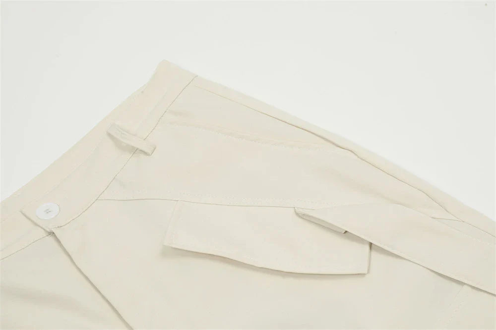 Stylish black overalls with pleated pockets, designed for the active Kiwi lifestyle