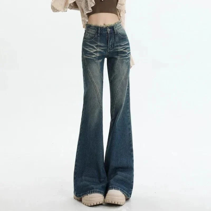 Pair of high-waisted flare jeans in a vintage wash, featuring functional details like tassels and buttons for a stylish, Kiwi-inspired look.