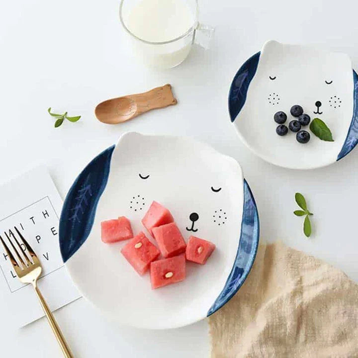 A charming ceramic plate featuring a vibrant cartoon animal pattern, perfect for adding a touch of Kiwi-inspired style to your dining table.