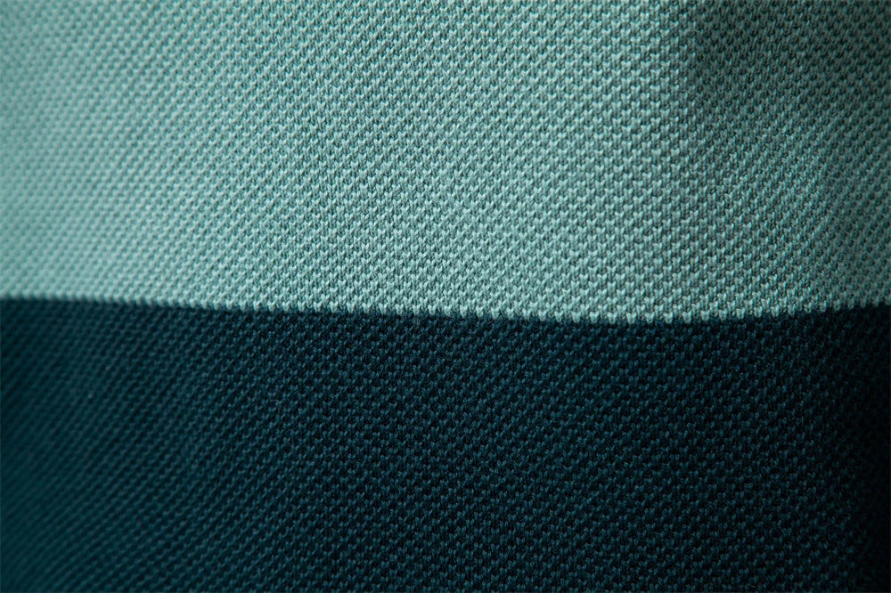 A stylish, slim-fit sweater in a modern colour-blocking design of Lake Green, White, and Grey, made with premium cotton for exceptional comfort and New Zealand casual style.