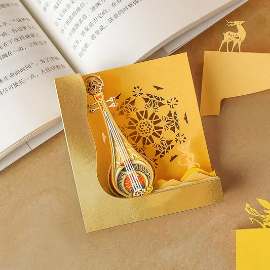 A three-dimensional paper carving notepad with a stunning Dunhuang Pipa design, a captivating desk accessory for the modern Kiwi office.